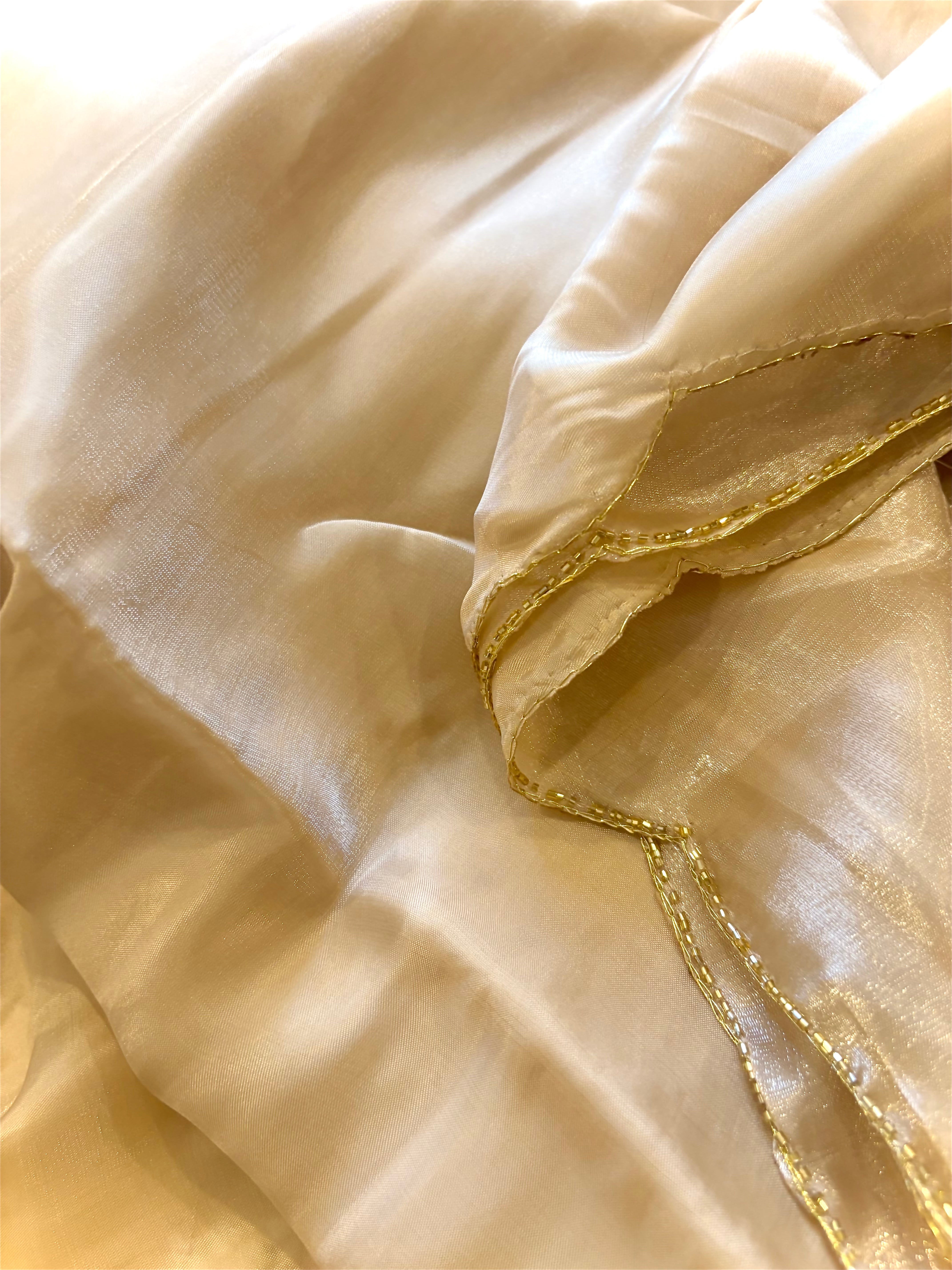 Aparajita Sunehri champagne gold sequin embroidered organza saree, draped